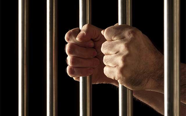 A man behind prison bars