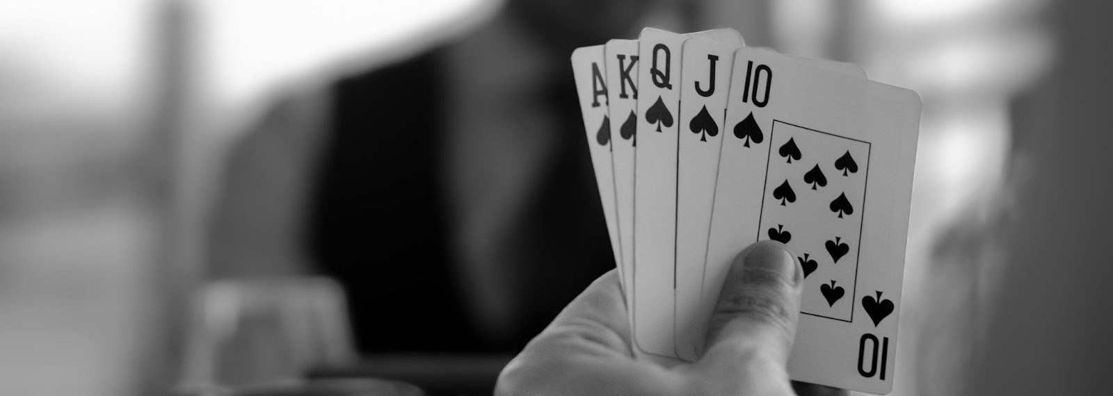 5 cards from 10 of spades to ace of spades forming a royal flush